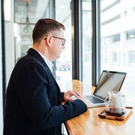 Man in a café on his computer